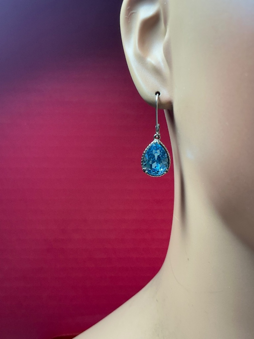 Sterling Silver Dangle Earrings with a Blue Topaz Stone. 1.25 inches long